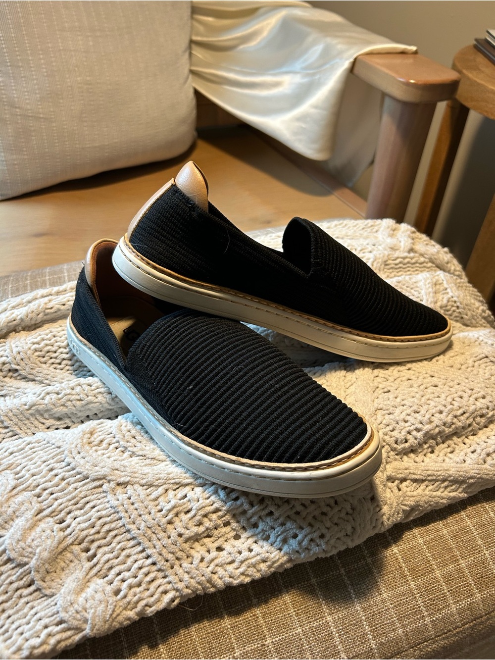 UGG woman’s Slip-On Knit Sneakers in Black